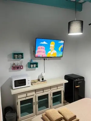 a living room with a tv on a wall at Casa Vladimir in Arcos de la Frontera