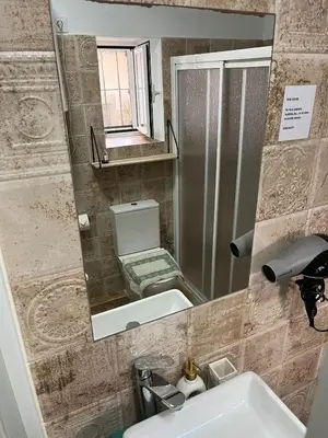 a bathroom with a sink and a mirror at Casa Vladimir in Arcos de la Frontera