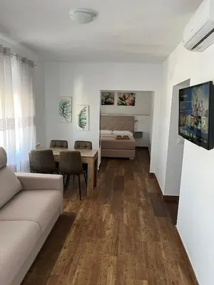 a living room with a couch and a table at Casa Vladimir in Arcos de la Frontera
