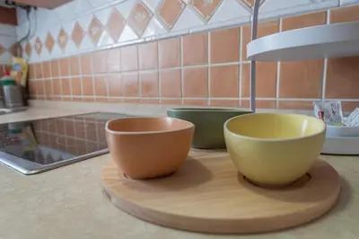 two bowls sitting on a cutting board on a kitchen counter at Terraza Estampa de Cádiz in Cádiz