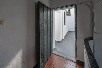 an open door in a room with a hallway at Terraza Estampa de Cádiz in Cádiz