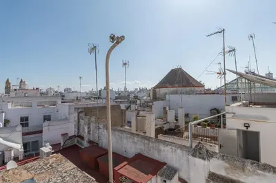 a view of a city from the roofs of buildings at Terraza Estampa de Cádiz in Cádiz