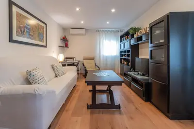 a living room with a couch and a table at Terraza Estampa de Cádiz in Cádiz