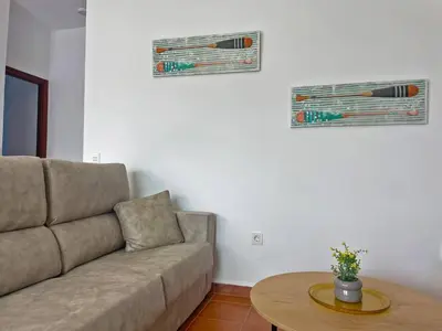 a living room with a couch and a table at Villa Nostos - Ole Solutions in Cádiz