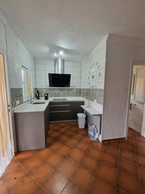 a kitchen with a sink and a counter top at Chalet a 2 kilometros de la playa in Chiclana de la Frontera