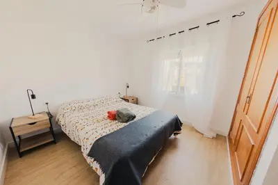 a bedroom with a bed with a stuffed animal on it at Chalet La Alberca in Chiclana de la Frontera