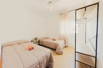 a bedroom with two beds and a basketball hoop at Chalet La Alberca in Chiclana de la Frontera