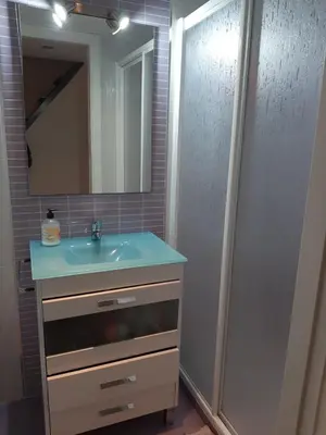 a bathroom with a sink and a mirror at Loft Las piletas in Sanlúcar de Barrameda