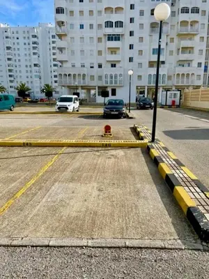 a parking lot with a red fire hydrant on a street at GATU Villa Salada, junto la playa, parking, terraza, aire acc, piscina, wifi Sólo familias o grupos mayores de 21 años in El Puerto de Santa María