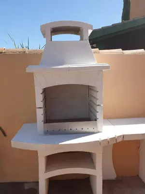 a white brick oven sitting on top of a bench at Villa Ostrero in Chiclana de la Frontera