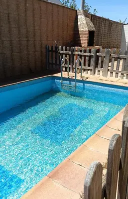 a swimming pool with blue water in it at Villa Bonita in Conil de la Frontera
