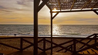 a view of the ocean from a beach house at Apartamento Dunas Candor - Ole Solutions in Rota