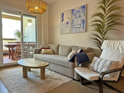 a living room with a couch and a table at Apartamento Dunas Candor - Ole Solutions in Rota