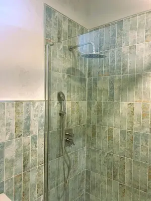 a bathroom with a shower with a shower head at Casa de Santa María in El Puerto de Santa María