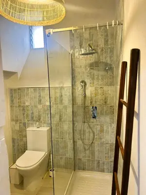 a bathroom with a shower with a toilet at Casa de Santa María in El Puerto de Santa María
