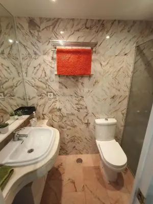 a bathroom with a toilet and a sink and a shower at Azvalia - Valdelagrana Puerto Príncipe, Playa, piscina, parking in El Puerto de Santa María