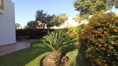 a garden with a pineapple in the middle of a yard at Villa Mar de Las Redes in El Puerto de Santa María