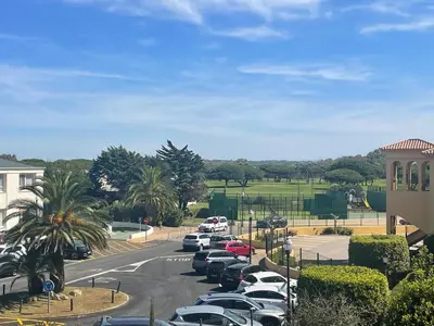 a parking lot with a bunch of cars parked at Margaritas 27 in Chiclana de la Frontera