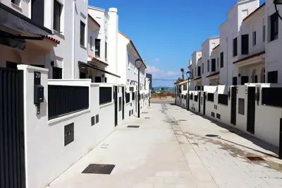 an empty alley with white buildings on either side at Mi UNIVERSO in San Fernando