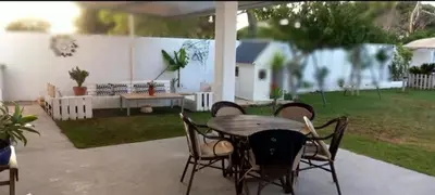 a patio with a table and chairs on a patio at Casa Pelicano in Chiclana de la Frontera