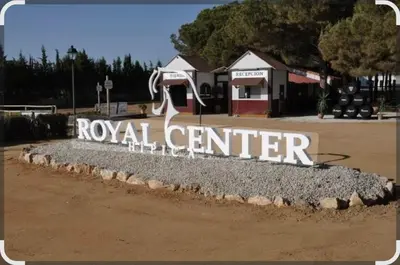 a rock center sign in front of a building at Casa Pelicano in Chiclana de la Frontera