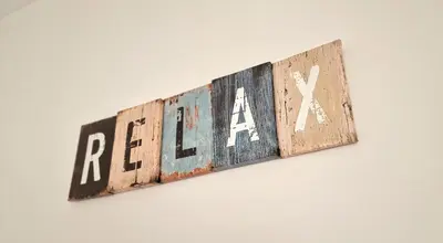 a sign that says heal hanging on a wall at Villa Candari in Chiclana de la Frontera