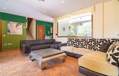 a living room with a couch and a table at Gorgeous Home In Conil De La Frontera in Conil de la Frontera