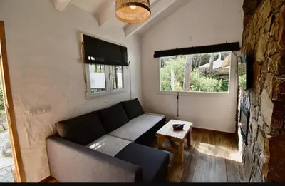 a living room with a couch and a table at Casa Palmito in Chiclana de la Frontera