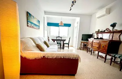 a living room with a couch and a table at MyChoice America in Rota