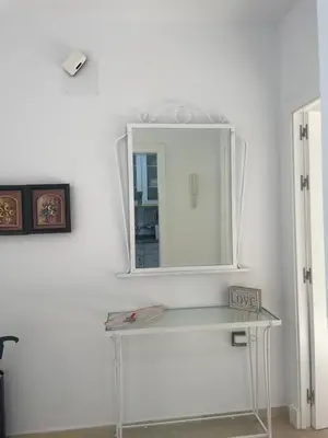 a mirror on top of a table in a room at Novo Atlantico Golf 7 in Novo Sancti Petri