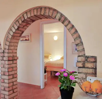an archway in a room with a bedroom at Sunny Home pool & Garden in Arcos de la Frontera in Arcos de la Frontera