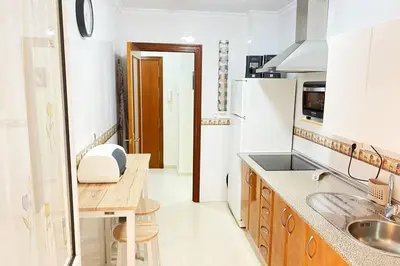 a kitchen with a sink and a counter top at Apartamento Camaleón in Chipiona
