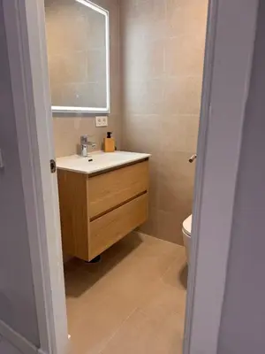 a bathroom with a sink and a toilet at Apartamento Pinares del atlantico in Chiclana de la Frontera