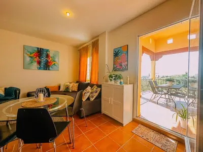 a living room with a couch and a table at DeCapi House in Sanlúcar de Barrameda