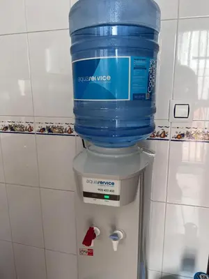 a container of water sitting on top of a water cooler at Casa de Fernando in Puerto Real