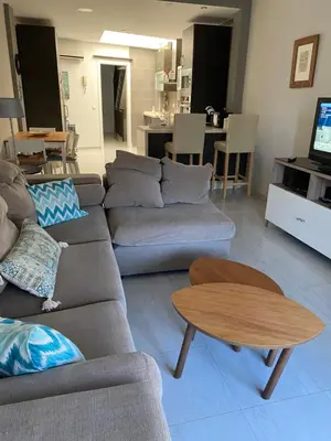 a living room with a couch and a table at LAS 7 ESQUINAS in El Puerto de Santa María