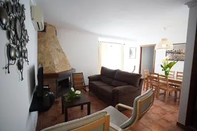 a living room with a couch and a table at Casa PauMar, tu casa en Arcos de la Frontera in Arcos de la Frontera