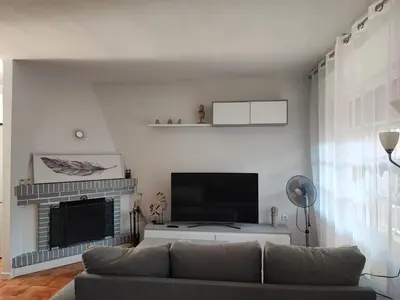 two beds with towels on top of them in a bedroom at Chalet Er SentI in Novo Sancti Petri