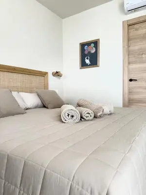 a large white bed with pillows on top of it at Alojamiento rural FINCA AZUCENA SUITE only adults in Conil de la Frontera