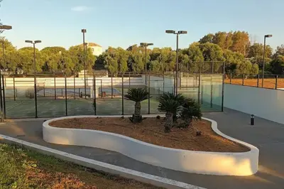 a basketball court with trees in a park at Casa Los Olivos in Arcos de la Frontera