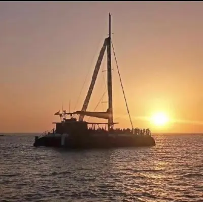 a group of people on a boat in the ocean at Apartamento Mistral 5, con piscina y parking. in Chiclana de la Frontera