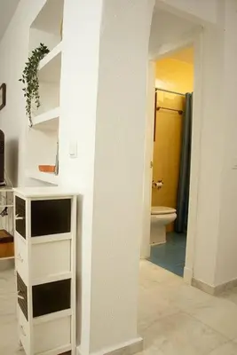 a bathroom with a white cabinet and a toilet at Duplex Las Torres La Barrosa 3Beds - A 700m de la playa in Chiclana de la Frontera