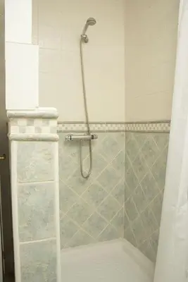 a shower with a glass door in a bathroom at Duplex Las Torres La Barrosa 3Beds - A 700m de la playa in Chiclana de la Frontera