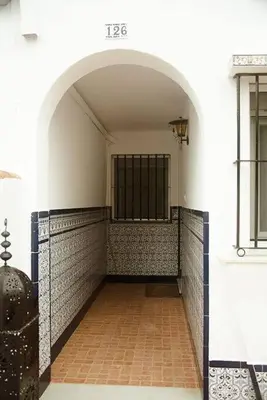 an archway in a building with a brick floor at Duplex Las Torres La Barrosa 3Beds - A 700m de la playa in Chiclana de la Frontera