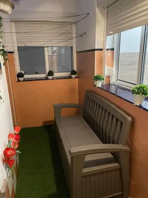a bench sitting in a room with a window at Casa Oceano in San Fernando