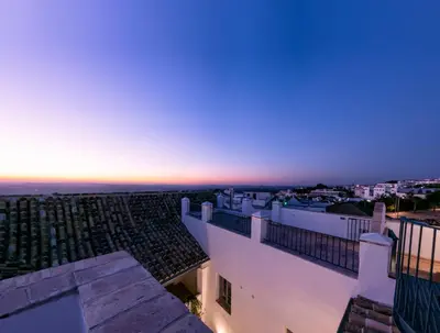a view from the balcony of a building at sunset at Casa del Museo - Agua in Medina Sidonia