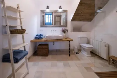 a bathroom with a sink and a toilet at Casa del Museo - Agua in Medina Sidonia