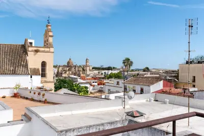 a view of a city from the roof of a building at Casa San Lucas - Corazón del Casco Histórico con piscina y parking in Jerez de la Frontera