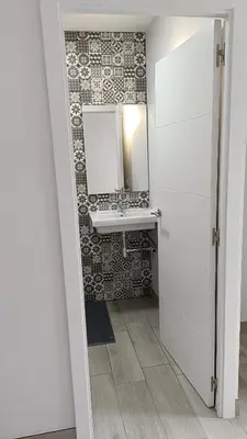 a bathroom with a sink and a mirror at Villa nazaret in Chiclana de la Frontera