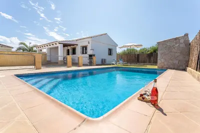 a swimming pool in the backyard of a house at EntreCalas 2 Chalet con piscina privada en Conil, Roche viejo, cala del aceite in Conil de la Frontera